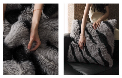 Close-up of plush faux fur zebra stripe pillow reversible soft touch gray black