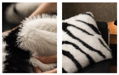 Close-up white black faux fur zebra pillow plush texture reversible design