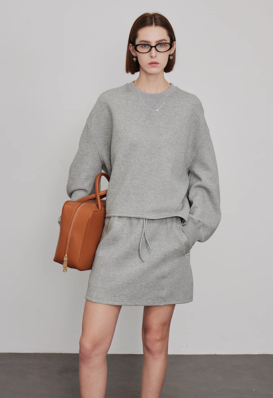 Women’s oversized grey sweatshirt with mini skirt, casual loungewear set