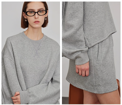 Close-up of grey sweatshirt and mini skirt fabric details