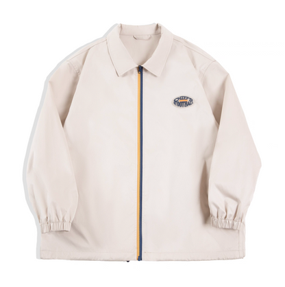 Off-White retro coach jacket with contrast blue-yellow zipper, front view.