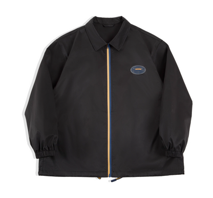 Black retro coach jacket with blue-yellow zipper, front view.