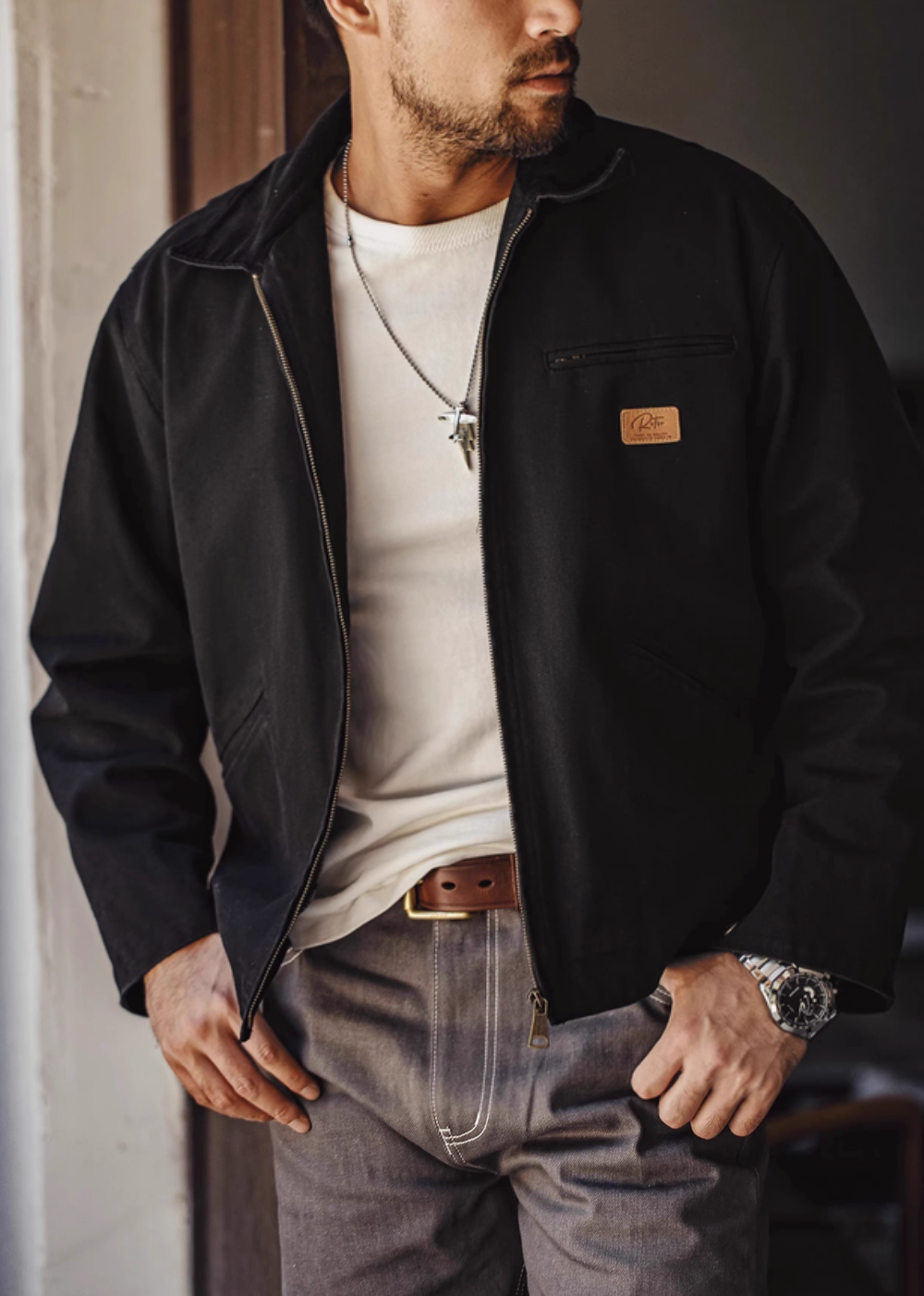Ironclad Canvas Work Jacket black front view worn with zip closure showing minimalist workwear style and structured fit