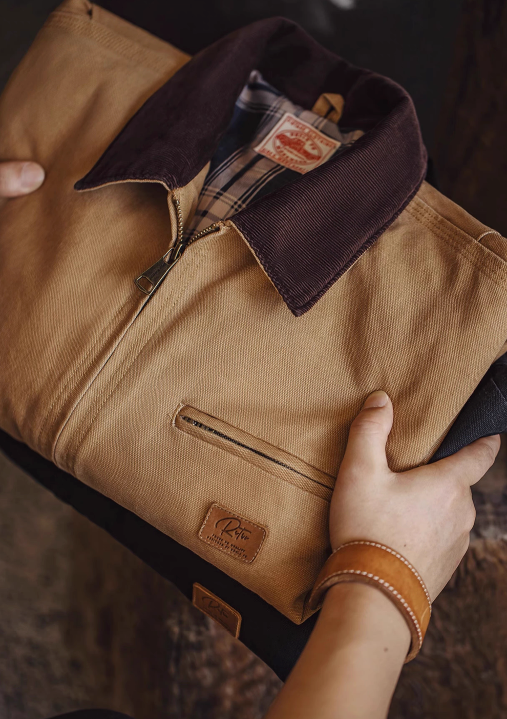 Ironclad Canvas Work Jacket khaki folded view highlighting heavy cotton canvas fabric texture zip front and structured collar detail
