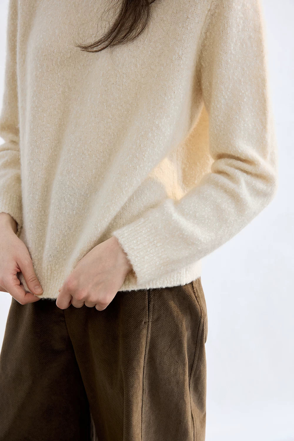 Ivory cashmere sweater, close-up of ribbed hem and cuff