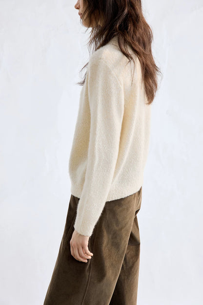 Ivory cashmere-silk sweater, side view on model
