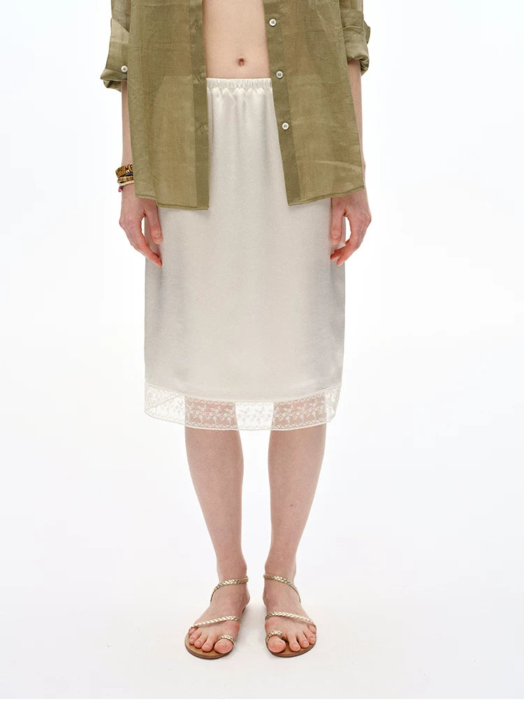 Front view of Ivory satin midi skirt with elastic waist and lace hem