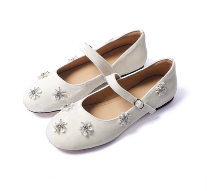 Pair of Ivory velvet Mary Jane flats with silver-tone beaded starbursts and buckle straps