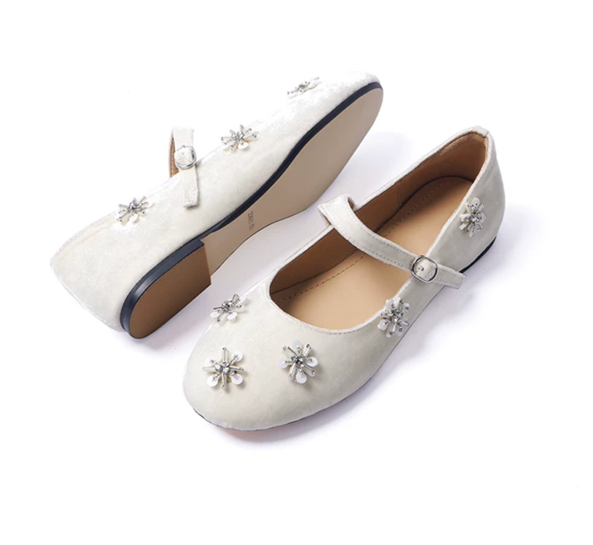 Ivory velvet Mary Janes showing the non-slip outsole and beaded toe details