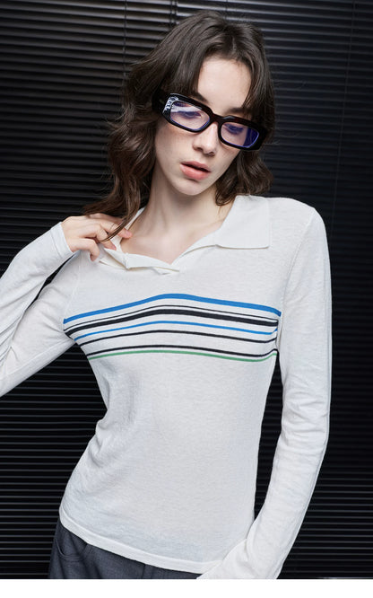Close-up of Ivory Stripe polo sweater showing Johnny collar, open V neckline and contrast chest stripes