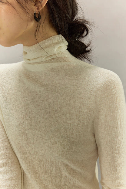 Ivory White turtleneck neckline showing seamless construction and fine texture.