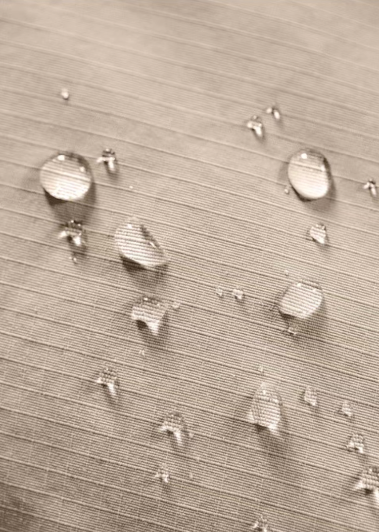 Water-repellent Taslon fabric with droplets on khaki Harrington jacket