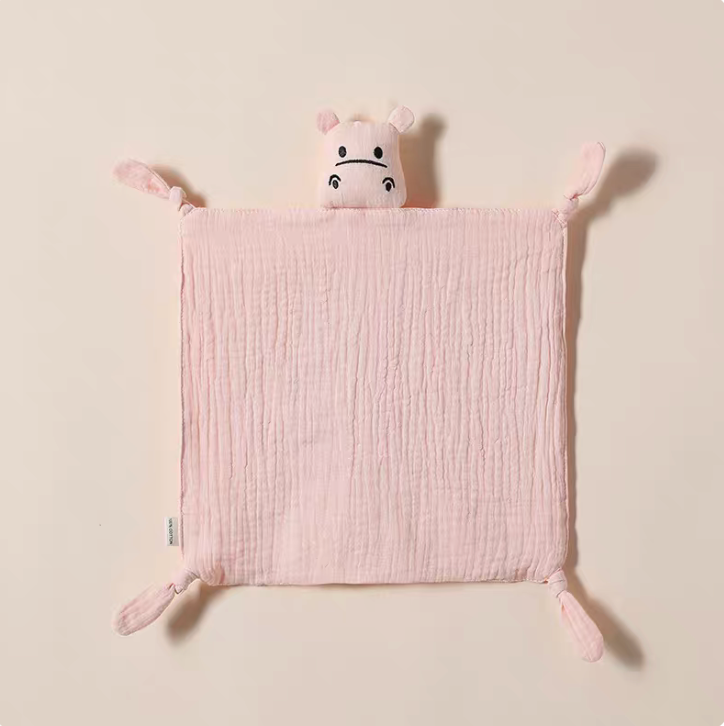 Light Pink knotted corner muslin baby lovey with plush animal design laid flat on neutral background