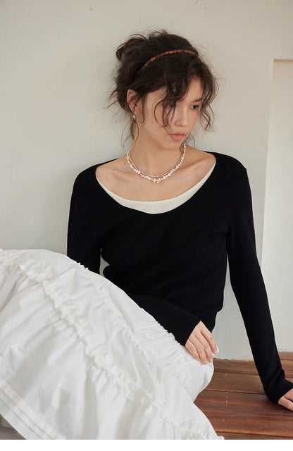 Layered Elegance Knit Sweater Top black sitting lifestyle pose slim fit layered look