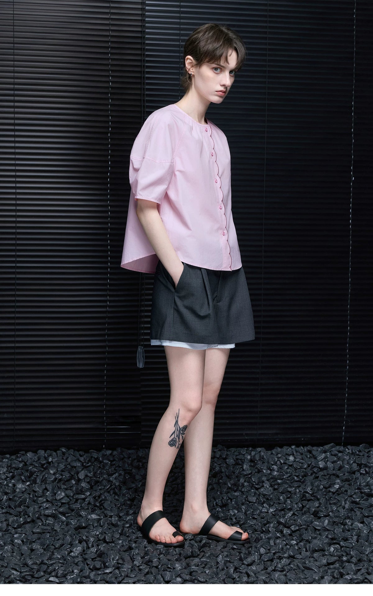 Full-length side angle of Light Pink boxy cotton blouse showing curved hem