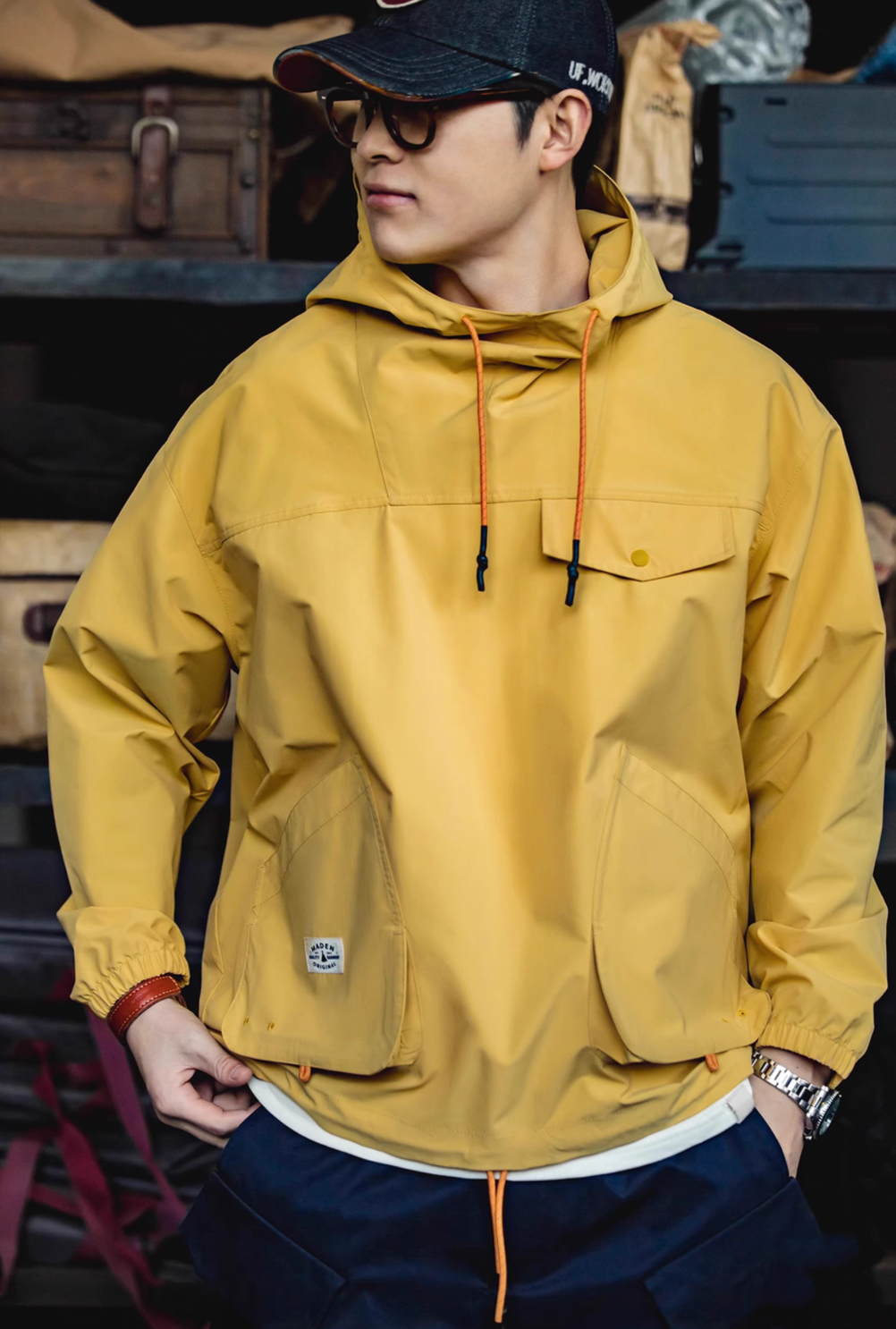 Man wearing Ginger Yellow Lightweight Hooded Anorak Jacket front view highlighting chest pocket, roomy fit and outdoor style
