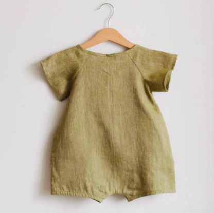 Back view of green lightweight cotton muslin baby romper hanging on hanger