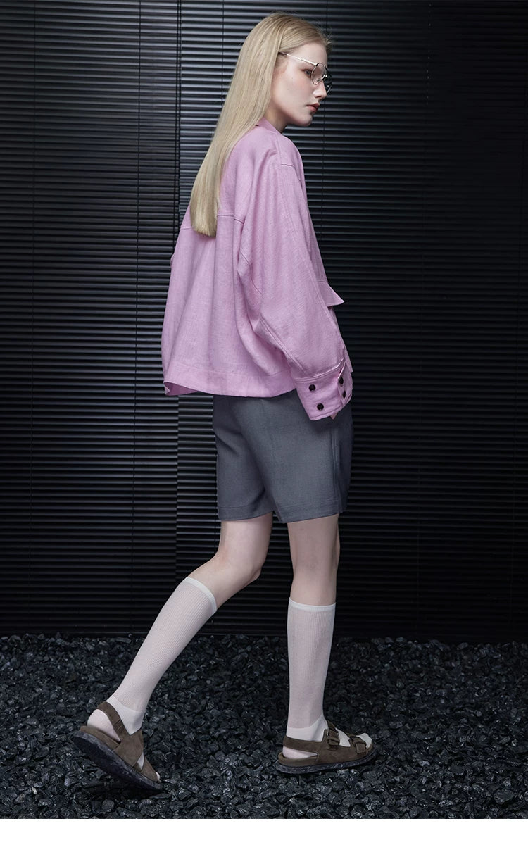 Side-back view of a Lilac Pink cropped linen jacket showing the boxy shape and dropped shoulders