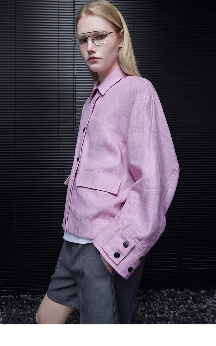 Three-quarter view of a Lilac Pink linen jacket showing the flap pocket and wide buttoned cuff