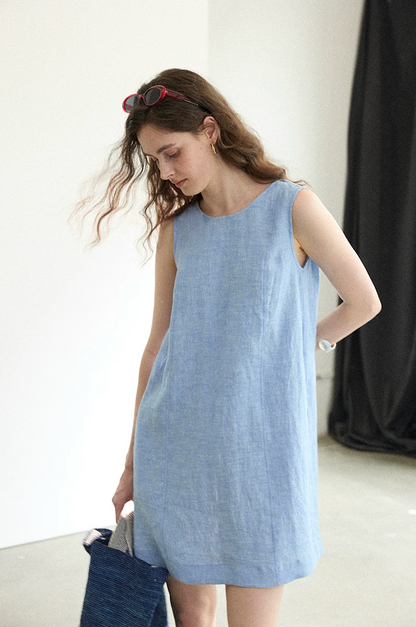 Chambray blue linen dress showing fabric texture and fit