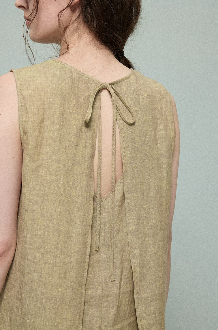 Close-up of olive linen dress back tie closure