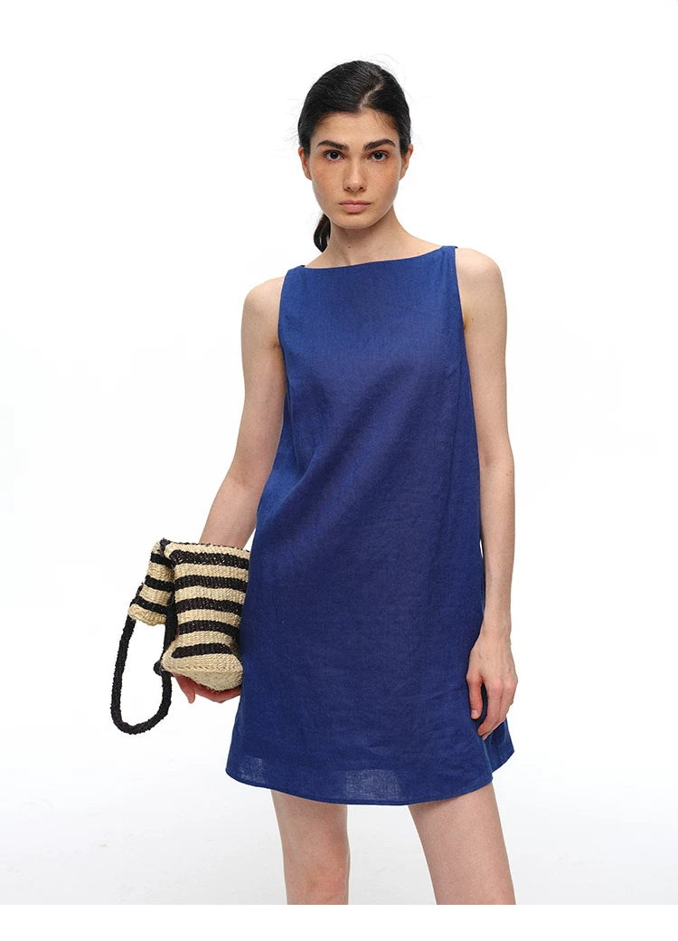 Royal blue linen shift dress with woven bag, front view