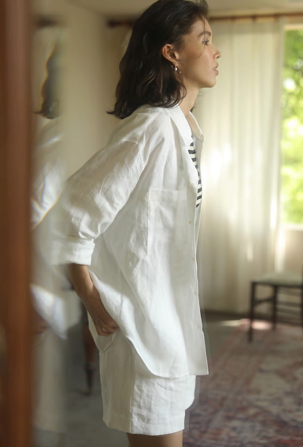 White linen collared shirt side view with relaxed silhouette lightweight summer layering piece