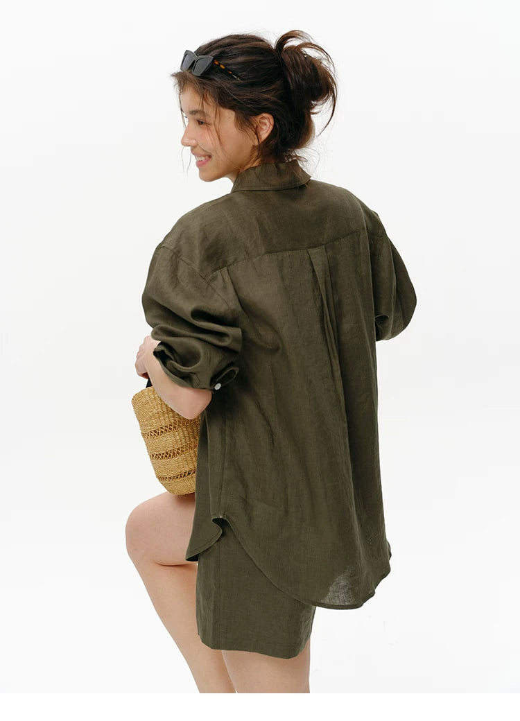 Back detail view of olive green linen shirt showing drop-shoulder seam