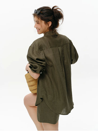 Back detail view of olive green linen shirt showing drop-shoulder seam