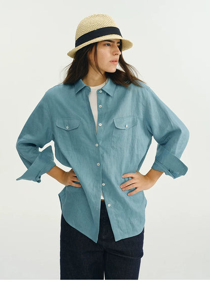 Front view of blue linen utility shirt showing chest pocket detail