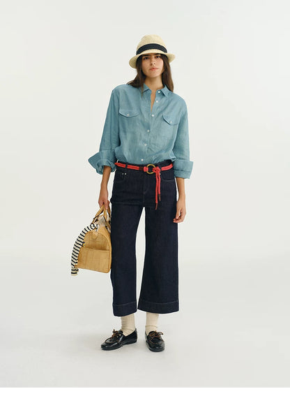 Blue linen utility shirt styled with red rope belt and wide-leg denim