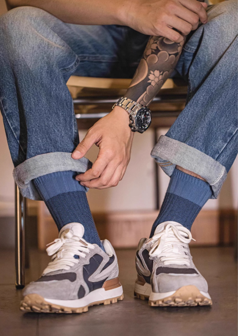 Lucky Chunky Knit Socks in navy blue styled with sneakers and rolled denim for a relaxed modern casual outfit