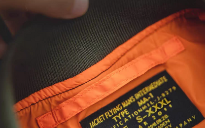 Ribbed collar and label detail of MA-1 flight jacket