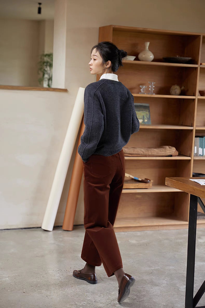 Shale gray merino wool sweater back view styled with trousers highlighting relaxed structure and clean finish