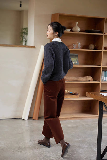 Shale gray merino wool sweater back view styled with trousers highlighting relaxed structure and clean finish