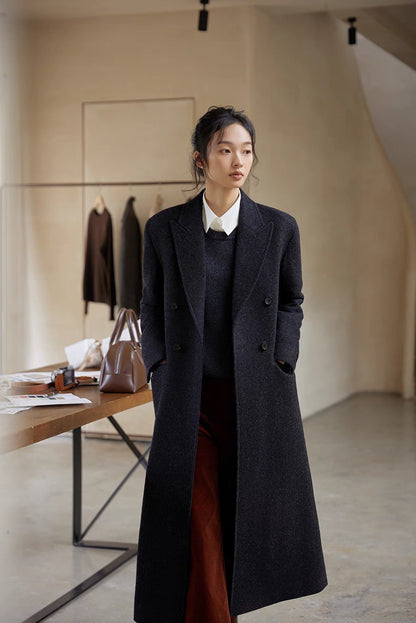 Shale gray merino wool sweater layered under long coat creating a polished and warm fall outfit