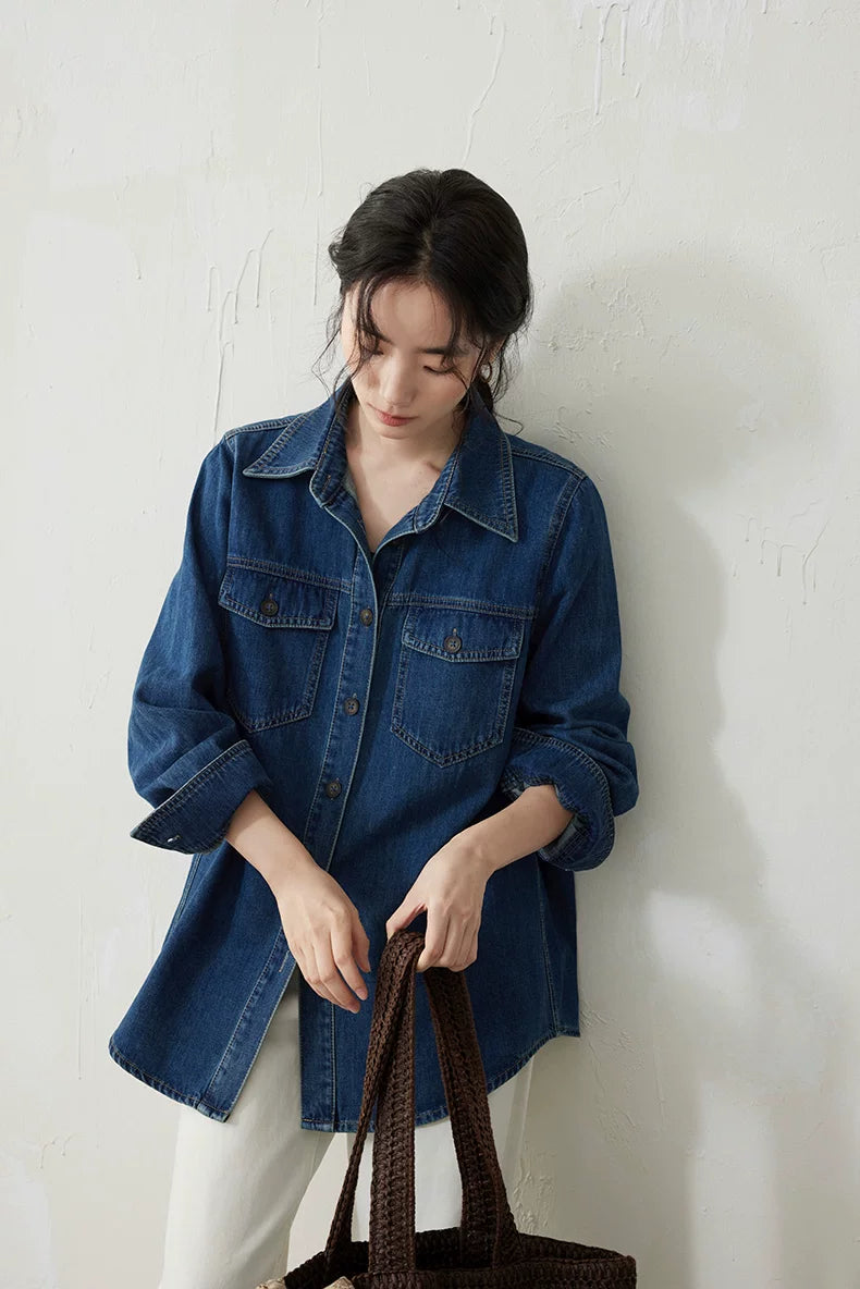 Medium blue denim overshirt worn with rolled sleeves, front view