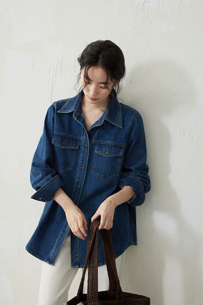 Medium blue denim overshirt worn with rolled sleeves, front view