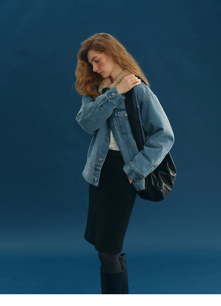 Side view of a Medium Blue wool-collar denim jacket showing the dropped shoulder and button cuff