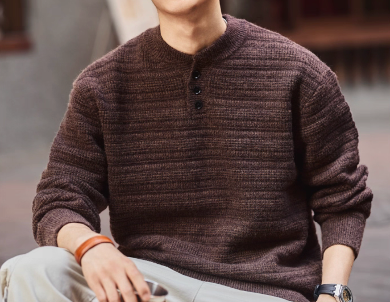Lifestyle shot of deep purple Henley sweater – cozy knit with casual outfit.