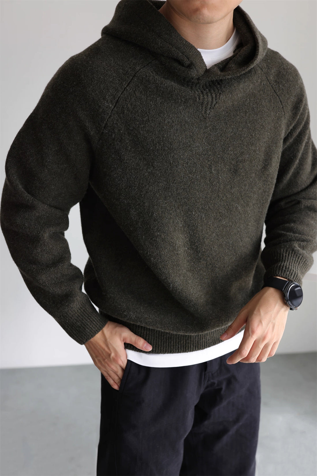 Men’s wool-blend knit hoodie in olive green, minimalist pullover front view