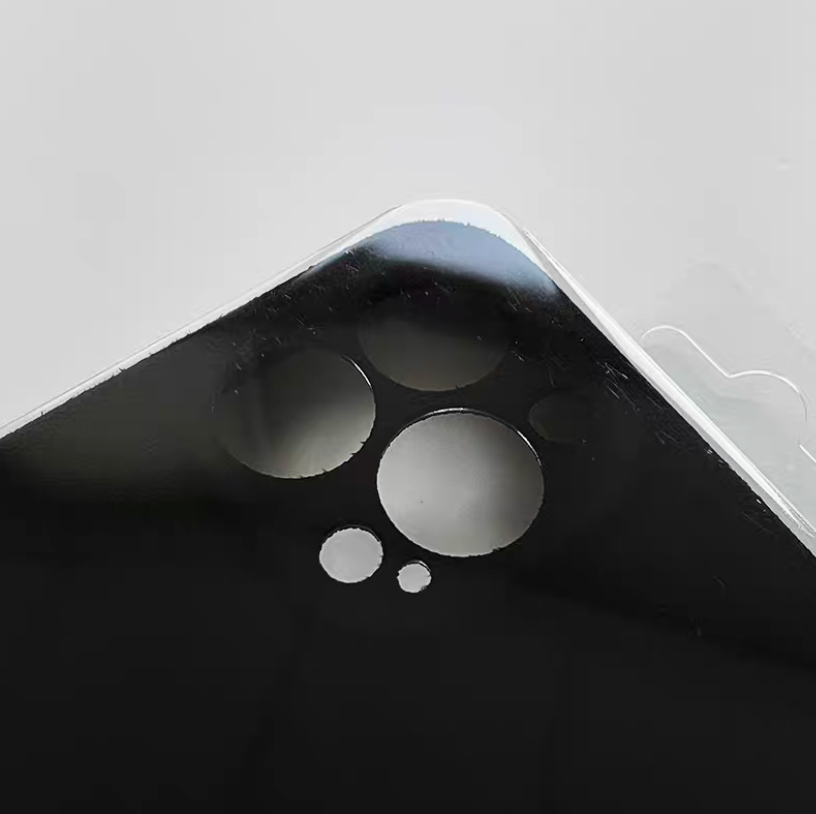 Black microfiber suede phone case close-up showing camera cutout and matte surface