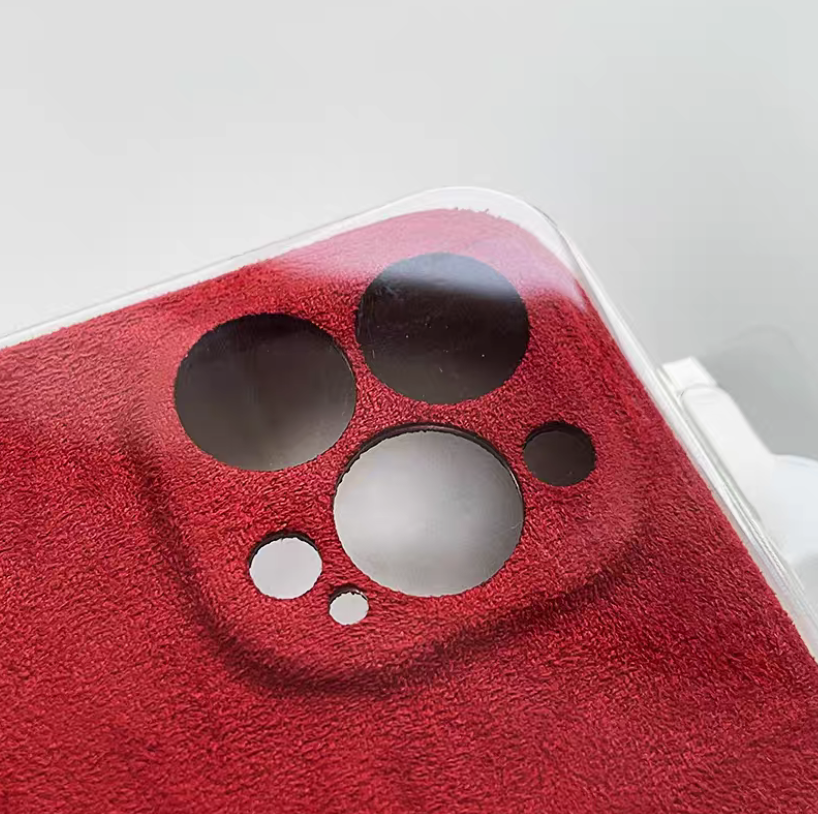 Burgundy microfiber suede phone case close-up of camera cutout with premium matte texture