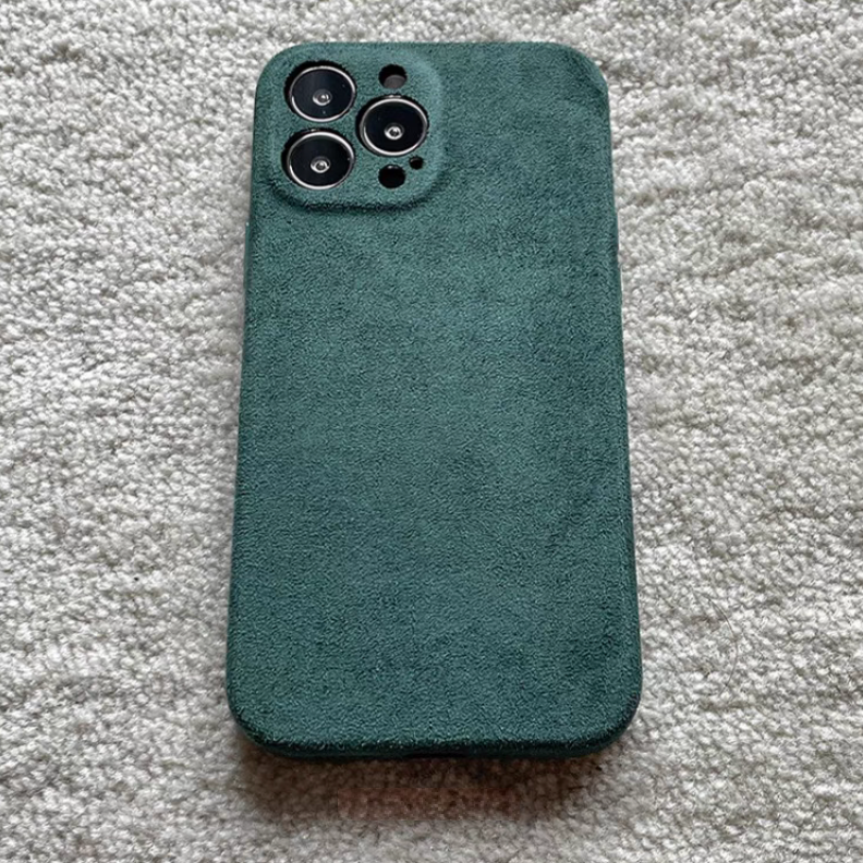Forest green microfiber suede matte phone case close-up showing camera cutout and soft texture