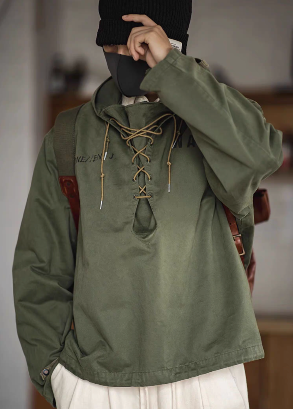 Army Green military deck jacket hoodie worn by model, front view highlighting rope-adjustable collar, loose fit and hooded design