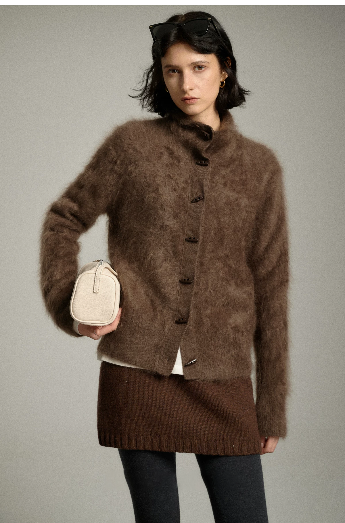 Mocha halo-soft cashmere cardigan with mock neck and dark toggle-shaped buttons, fully buttoned