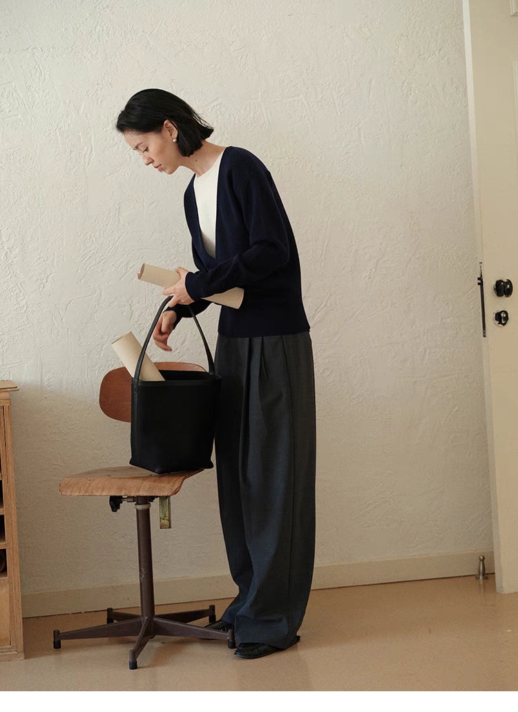 Full body view of Navy Blue Modern V-Neck Relaxed Sweater with wide-leg pants and bag showing effortless everyday styling