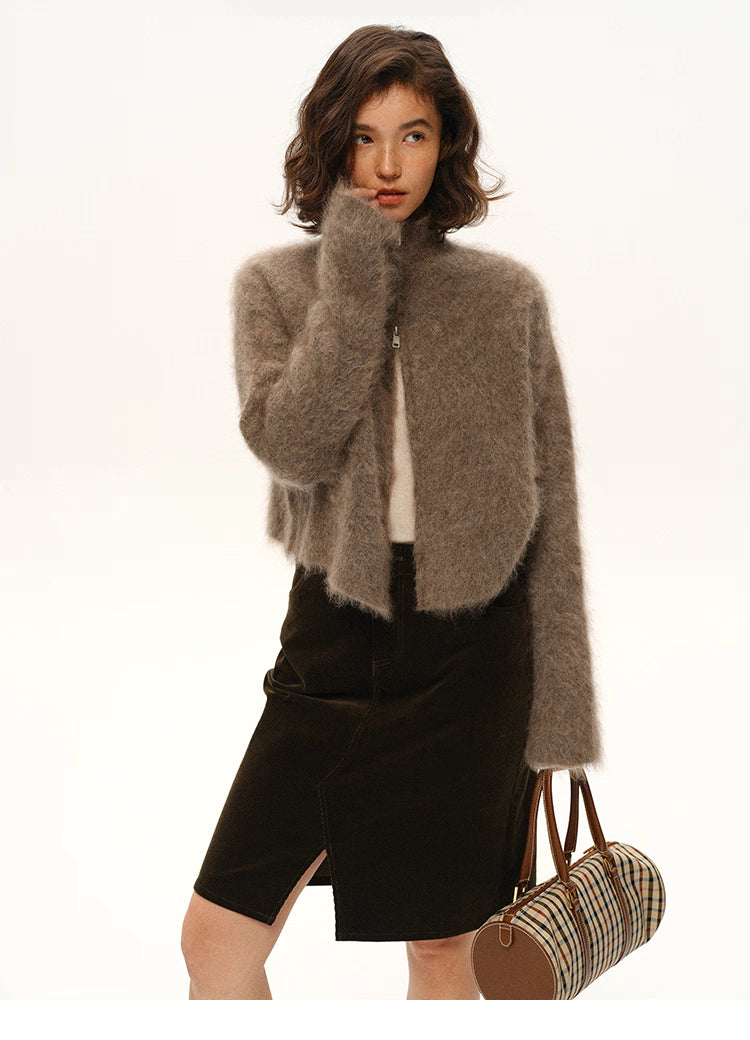 Full-body view of smoky brown fuzzy mohair cardigan styled with skirt