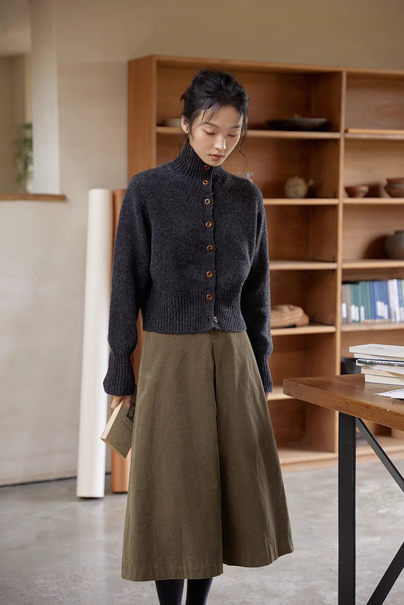 Dark gray wool cardigan front view with ribbed hem, mock neck and natural button closure