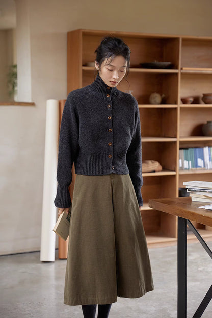 Dark gray wool cardigan front view with ribbed hem, mock neck and natural button closure